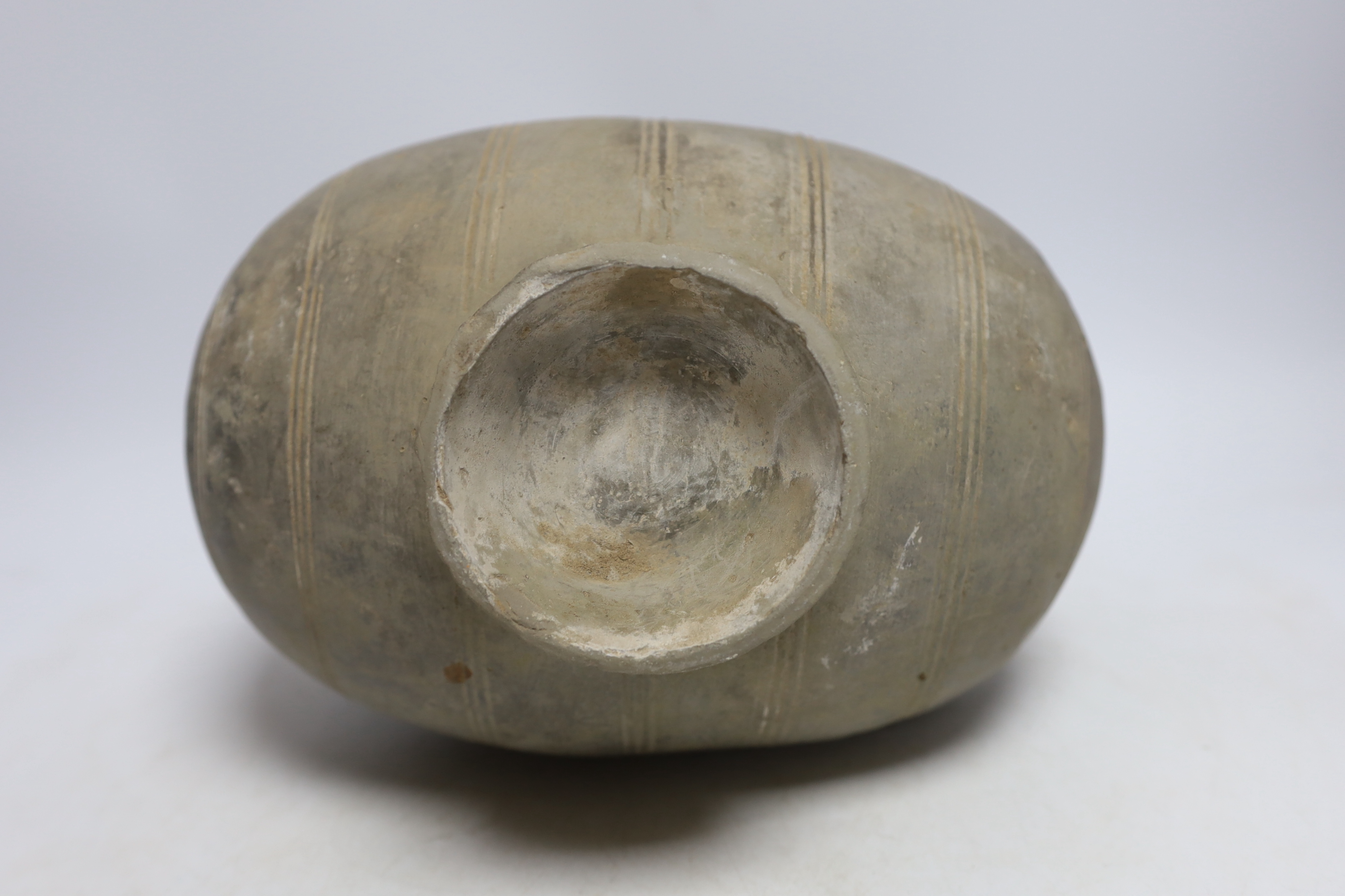 A Chinese grey pottery 'cocoon' jar, Han dynasty, 27cm